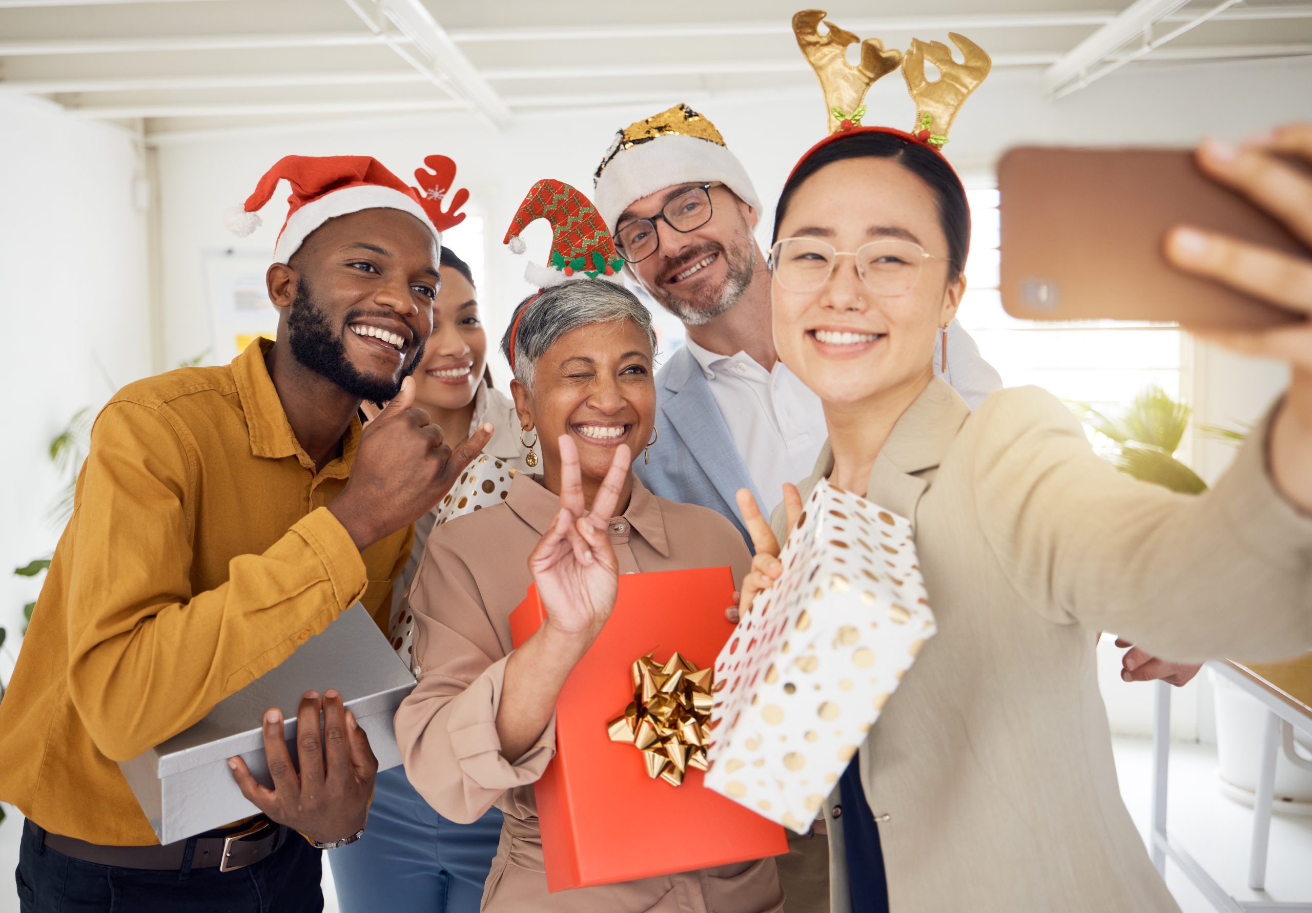 Business people, Christmas selfie and staff for smile, present or peace sign for celebration, diver.