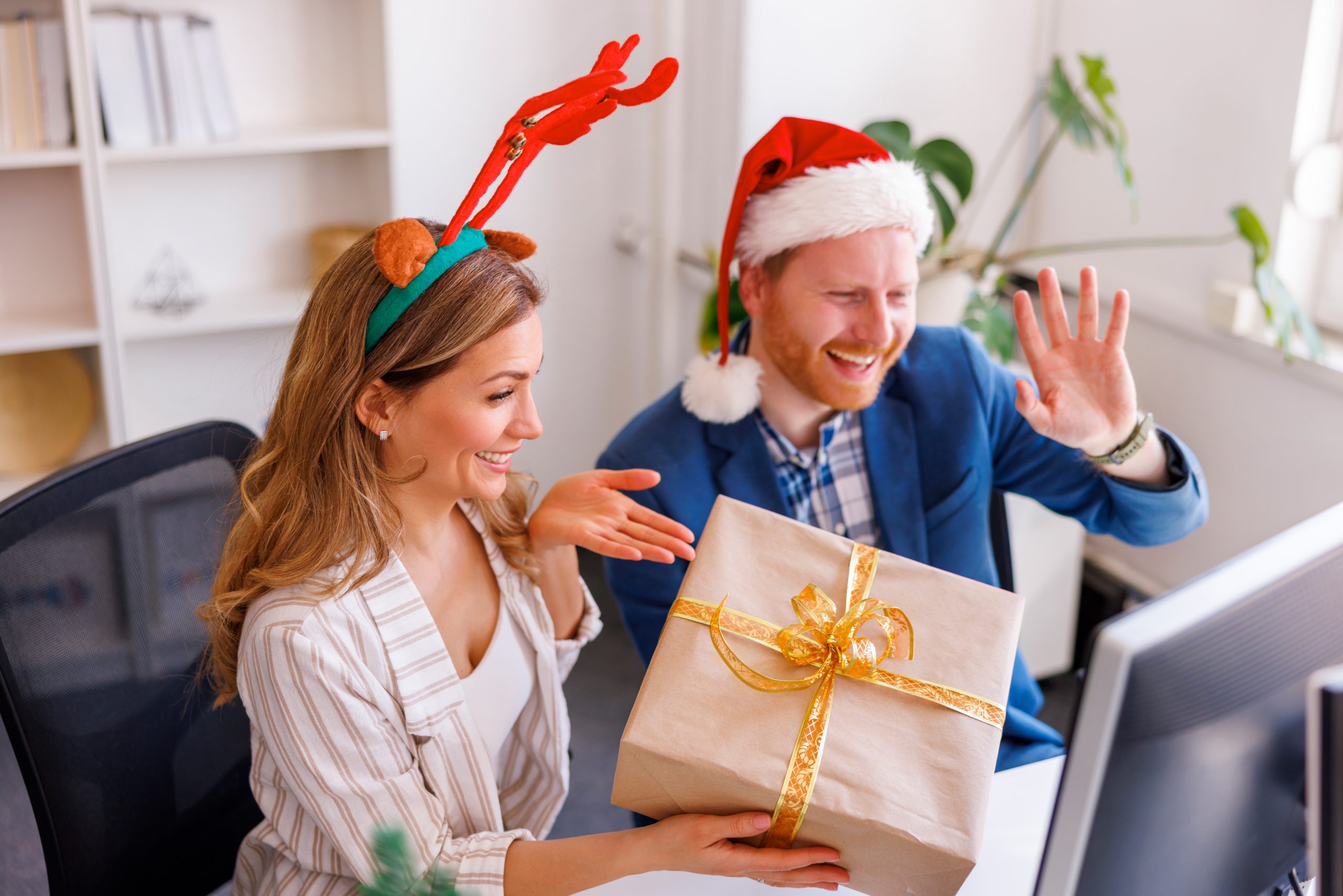 Business team exchanging Christmas presents at the office