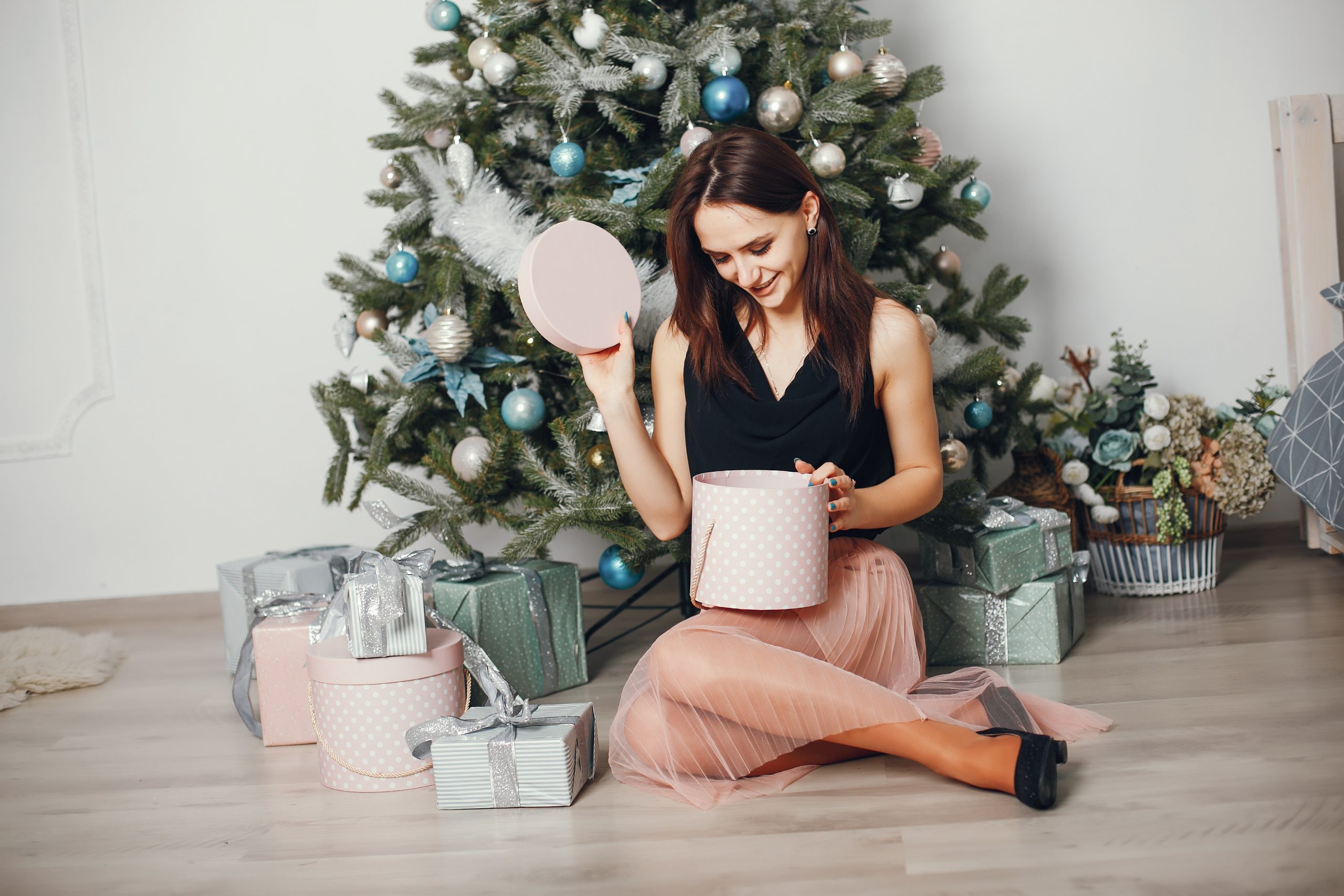 beautiful young and fashion girl celebrate christmas at home with gifts