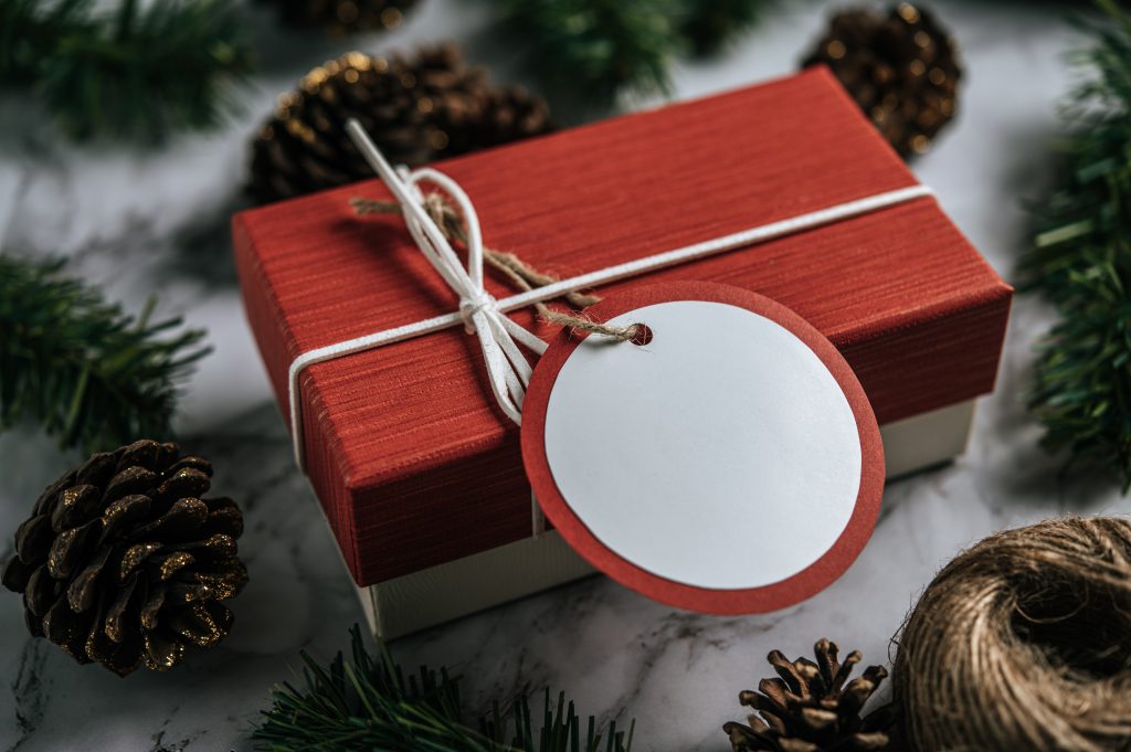 Gift boxes with small gifts on white cement