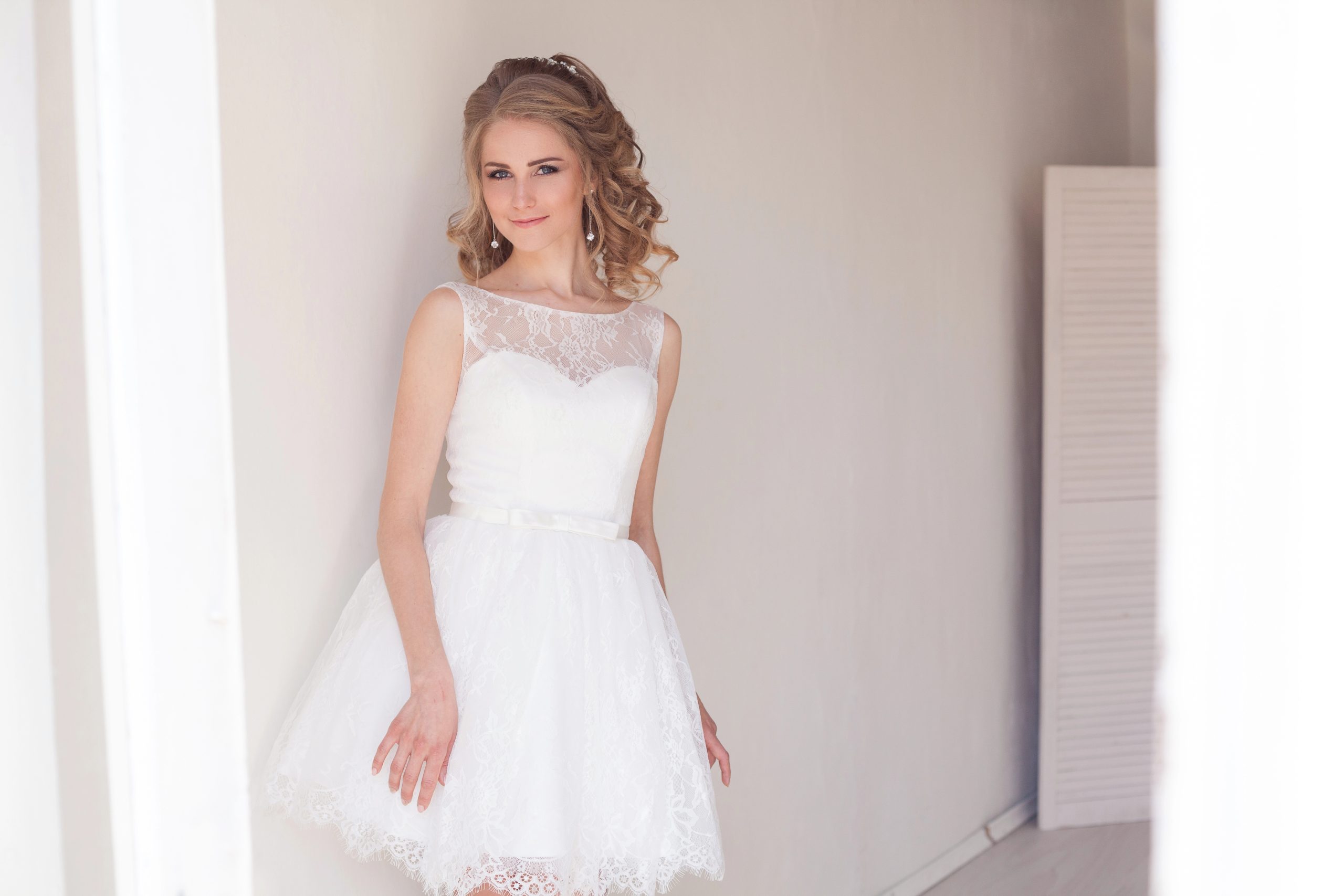 beautiful bride in short white wedding dress
