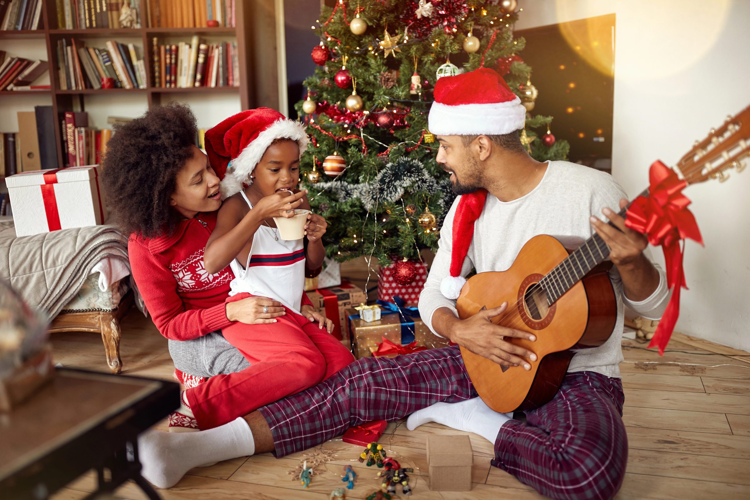 father with new guitar christmas gift