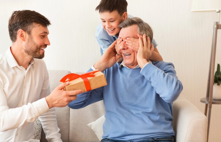 Grandpa getting gift from son