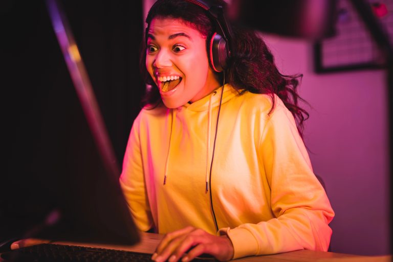 young girl laughing playing computer games