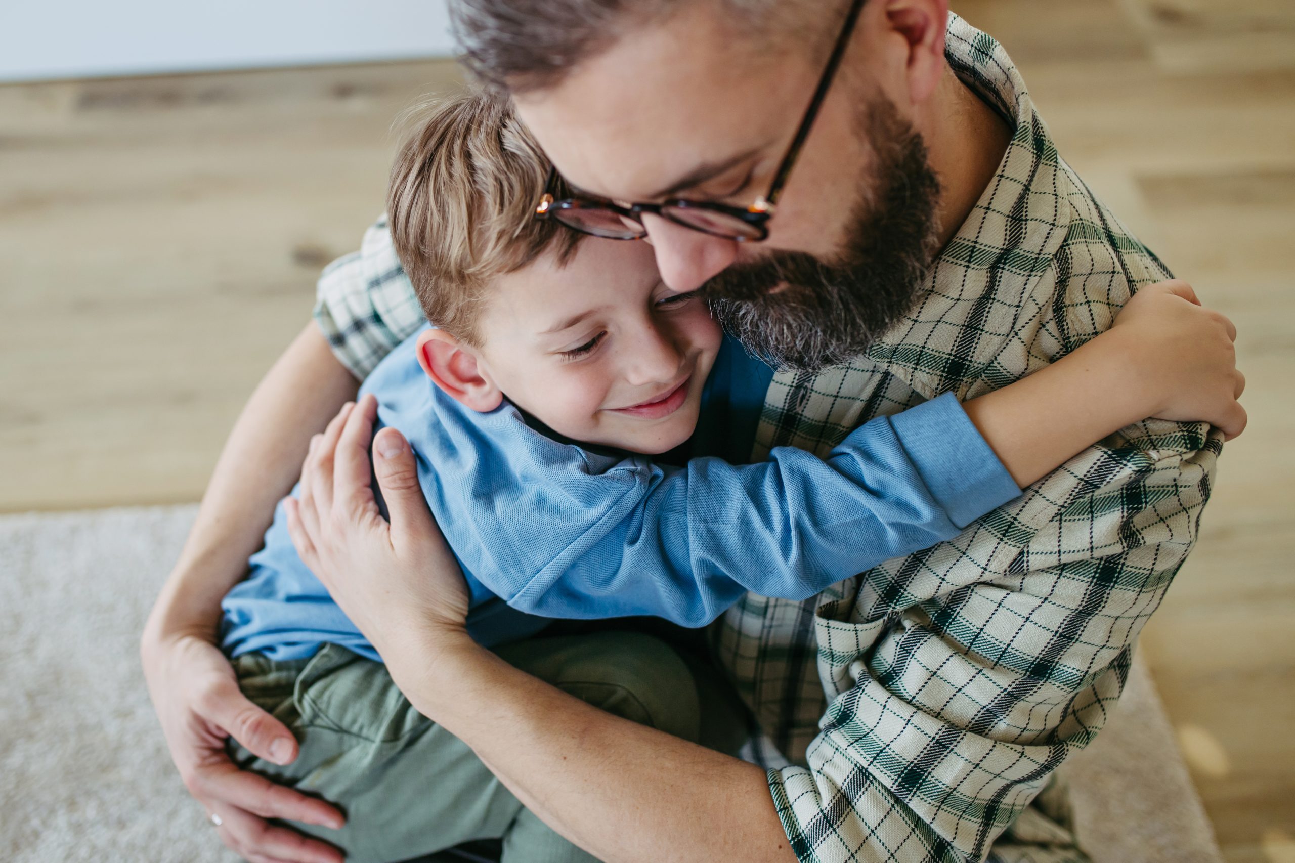 Dad hugging little son, true love. Happy Fathers day