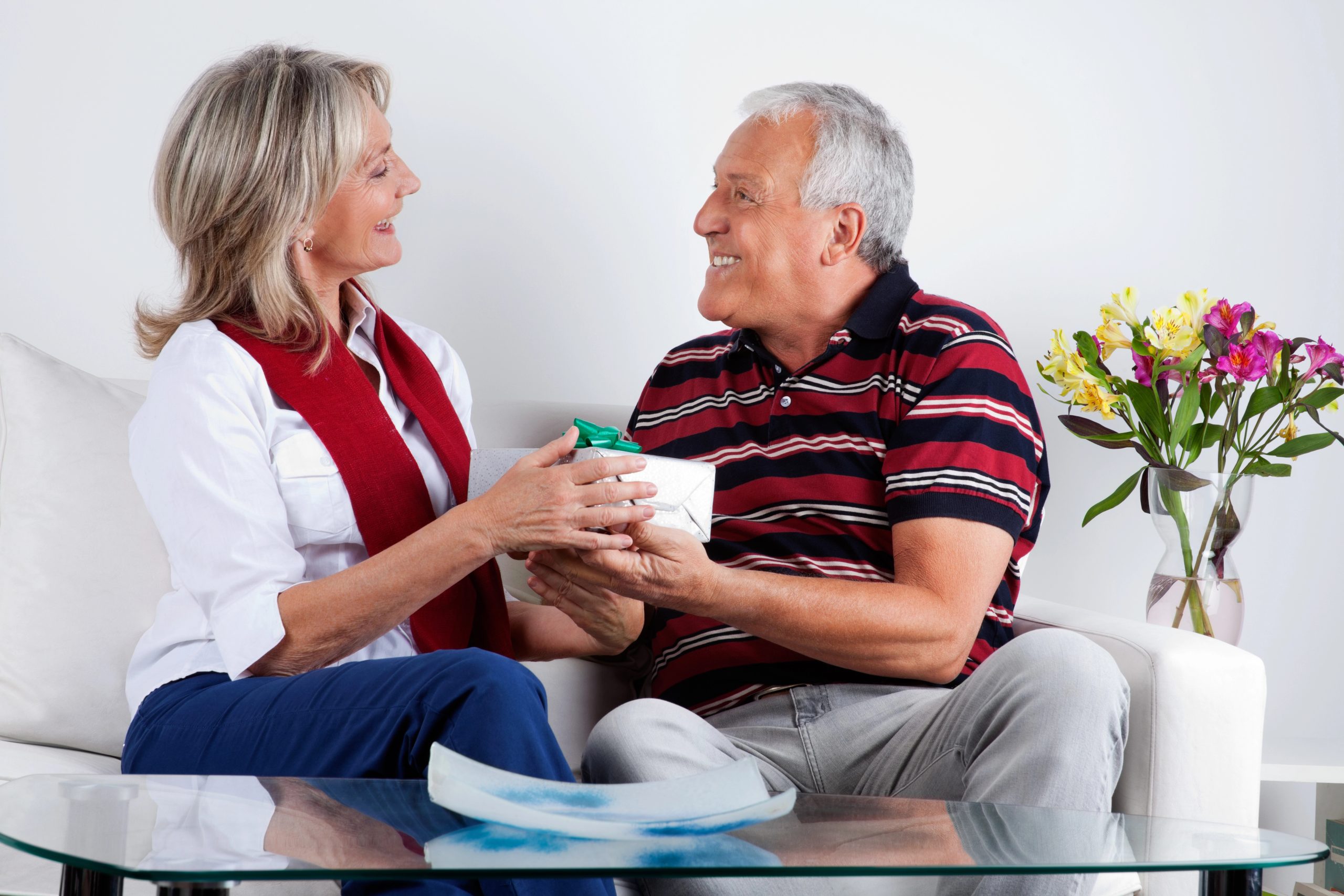man and woman happy receiving christmas gift