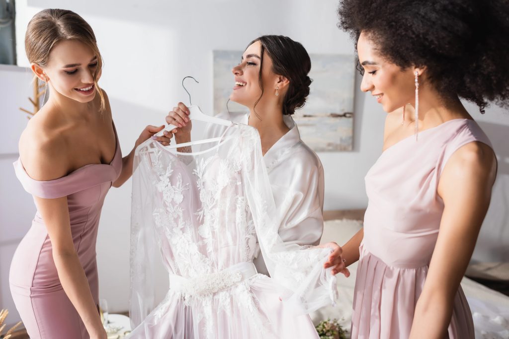 happy bridesmaids with satin dresses