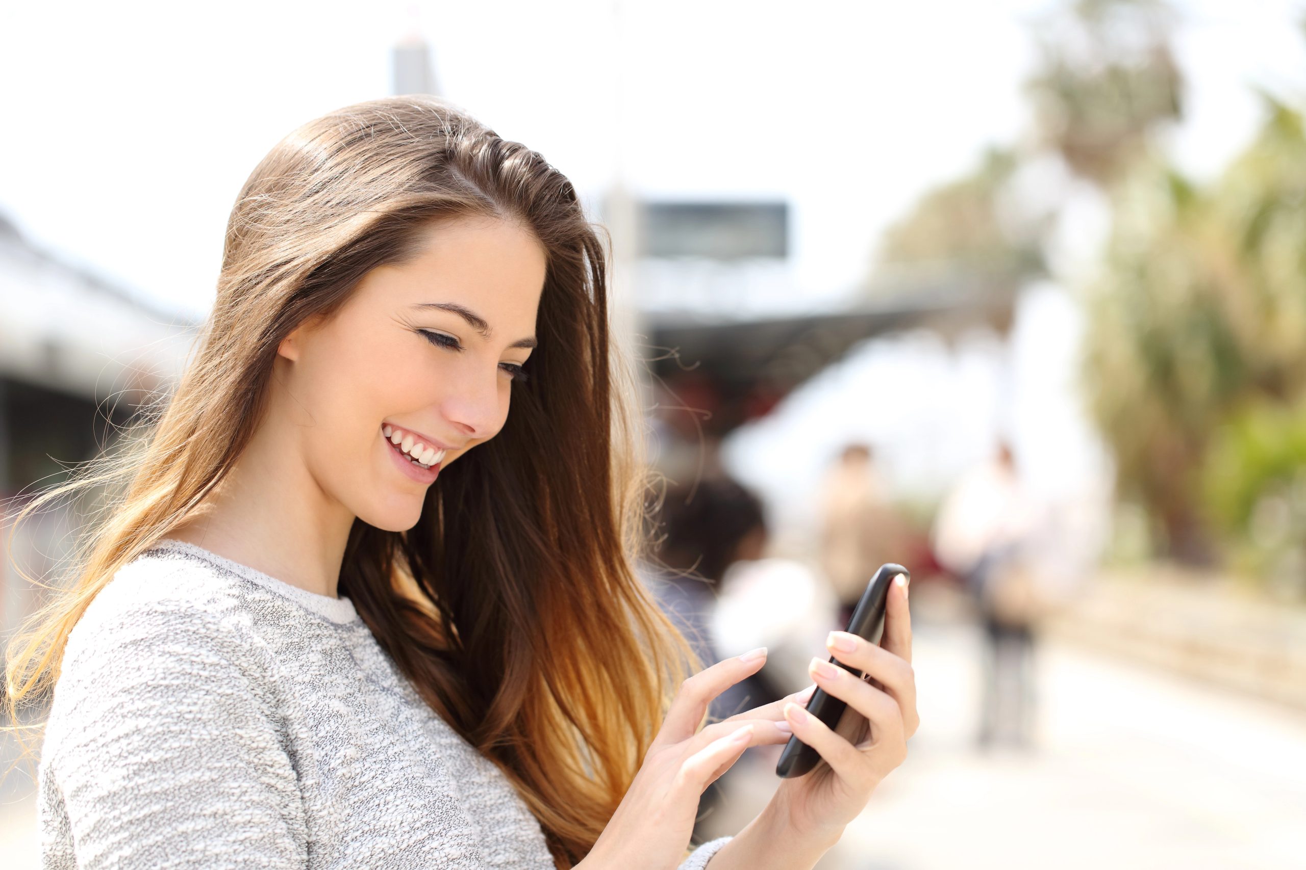 young woman using myregistry app on phone