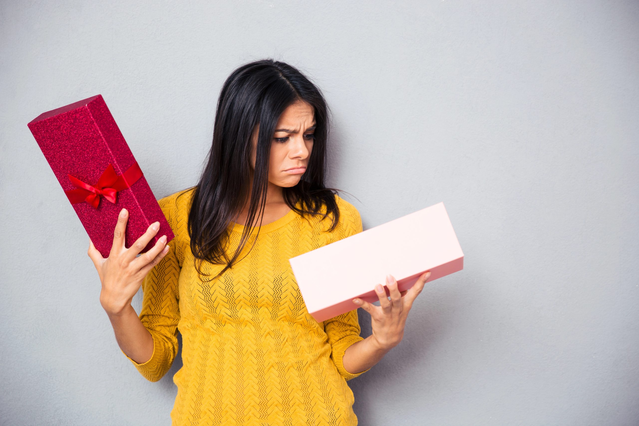 woman opening a bad gift