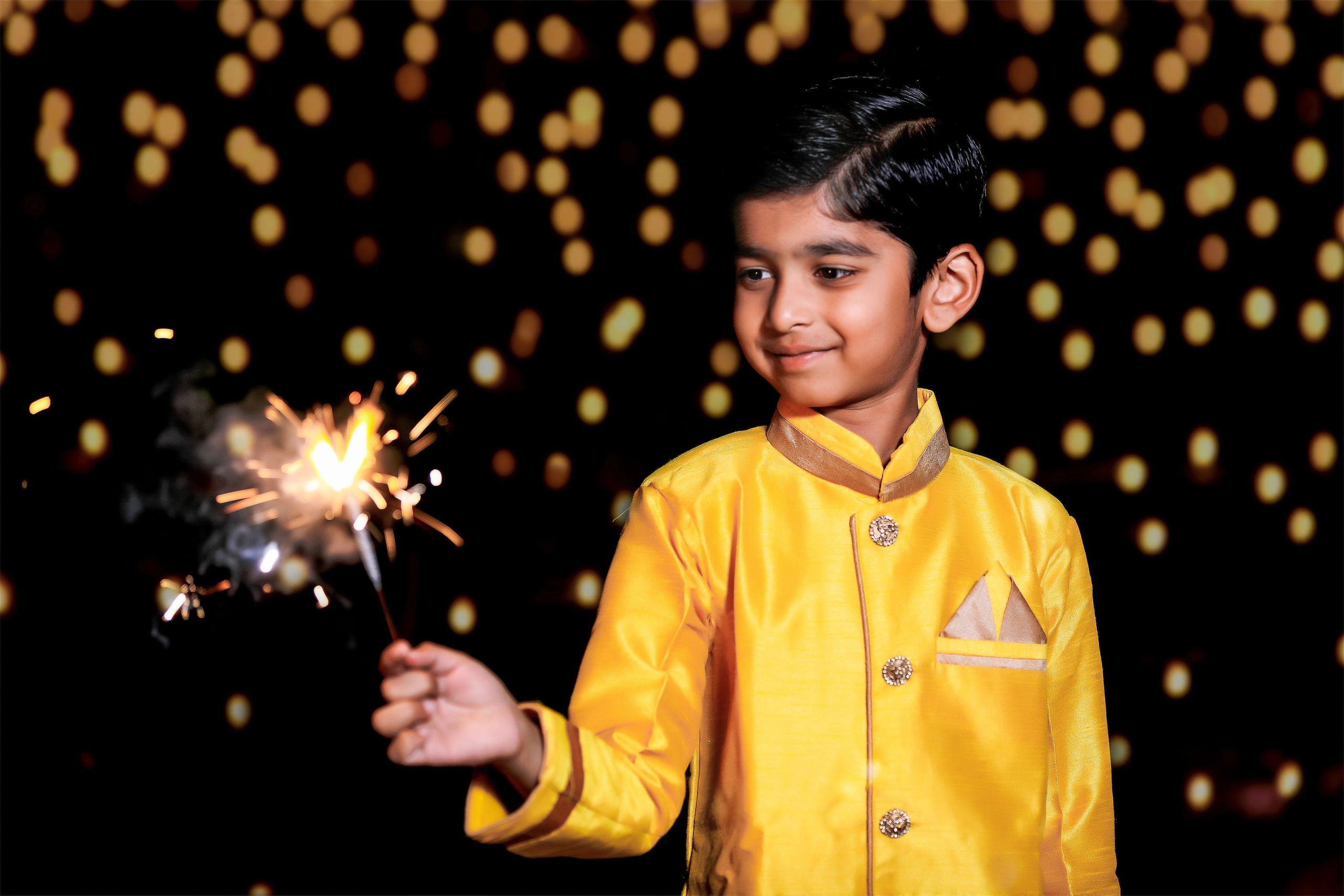 indian boy with sparkler for diwali