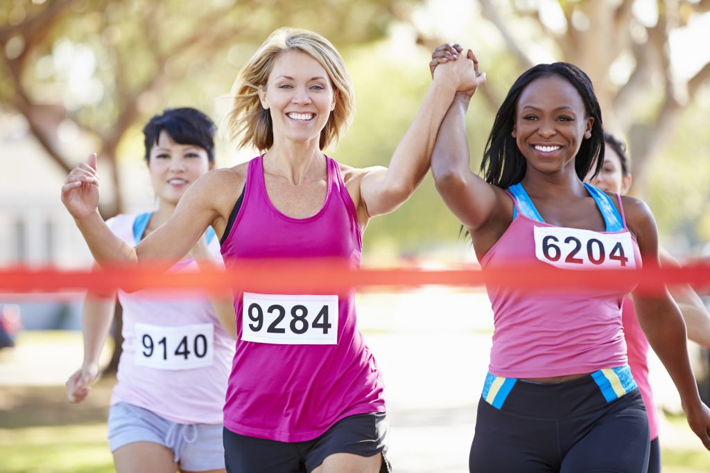 women running marathon together