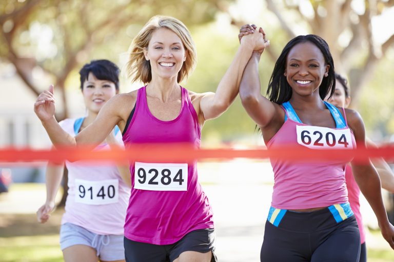 women running marathon together