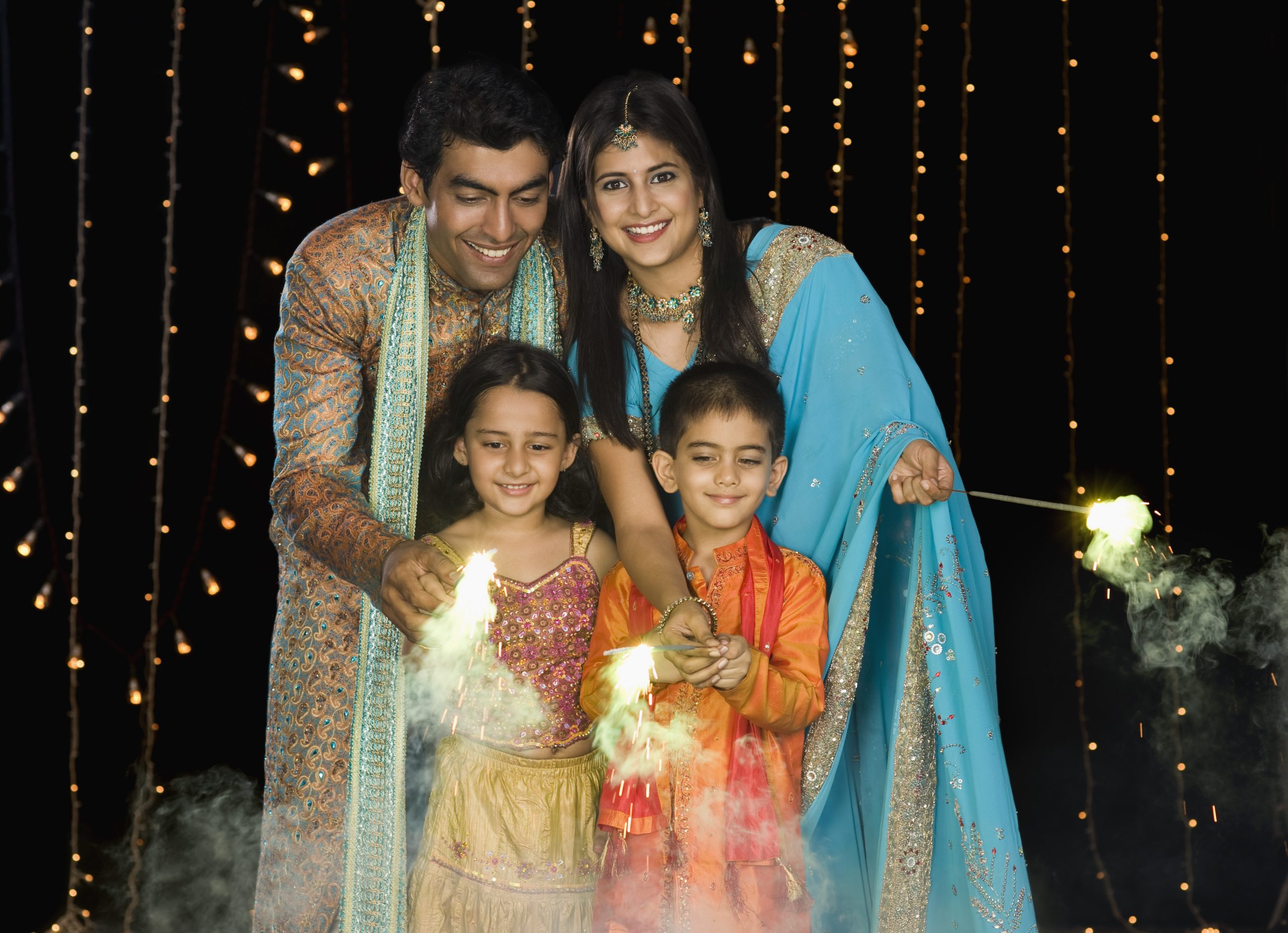Family celebrating Diwali festival at home