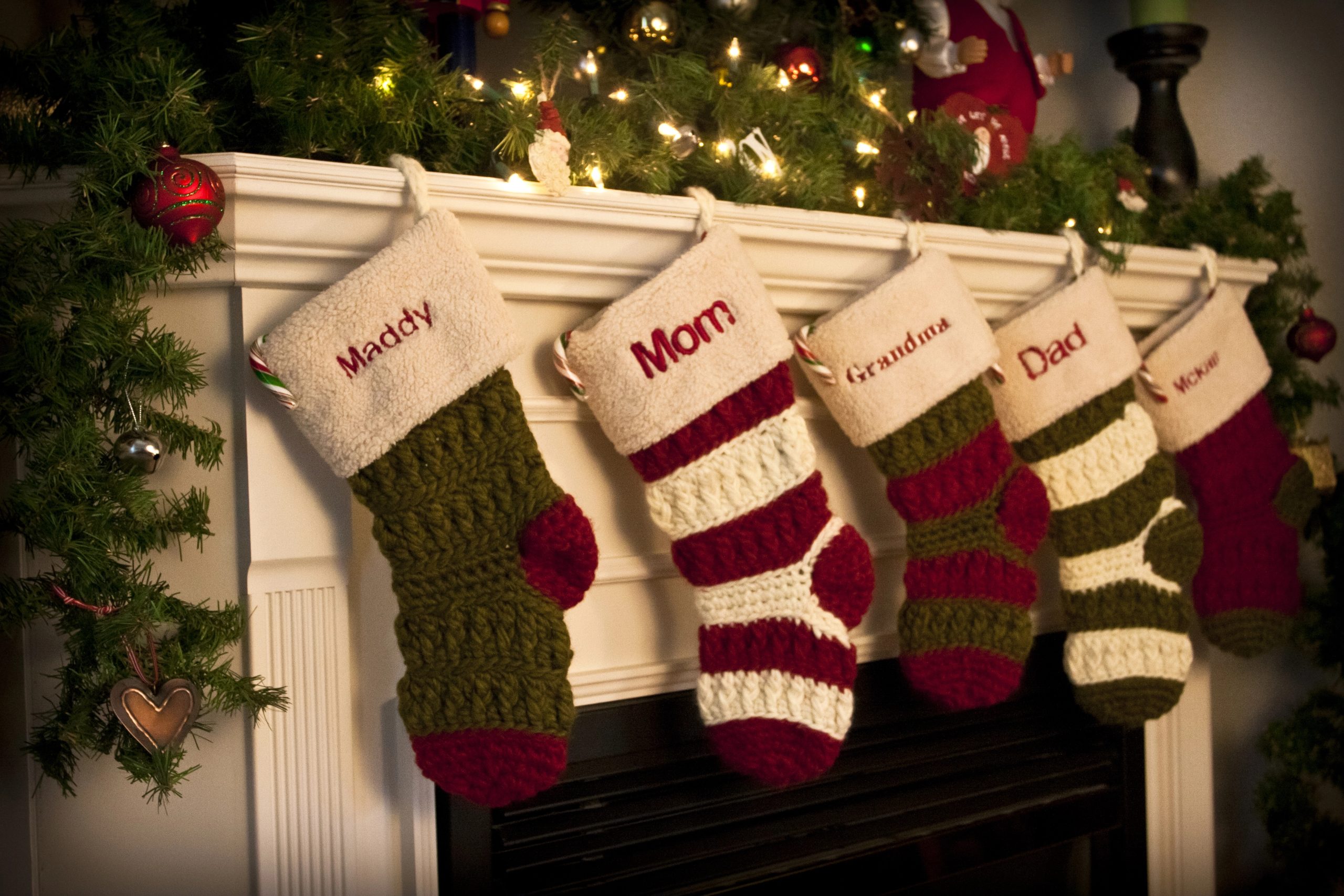 cute christmas stockings on fireplace