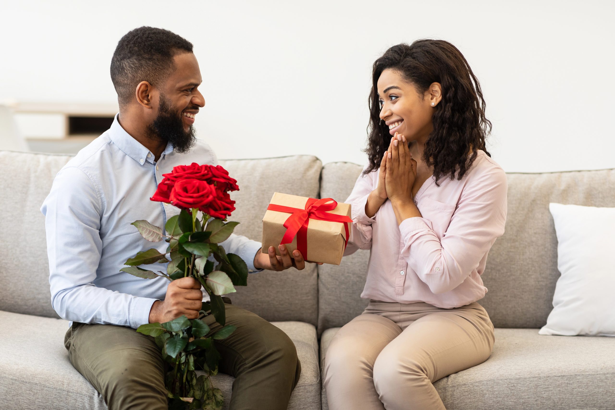 man giving thoughtful gift to wife