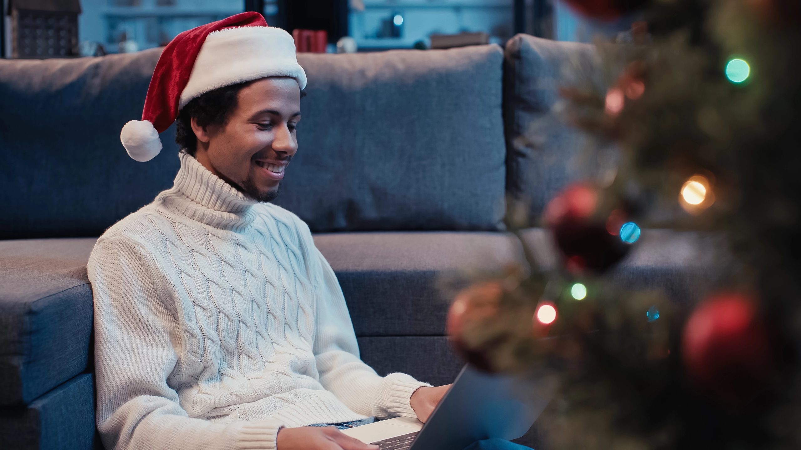 man hosting virtual secret santa at home