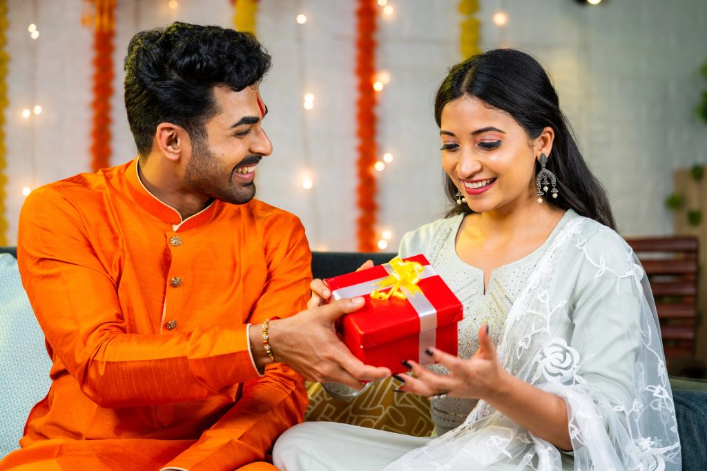 indian man giving wife diwali gift