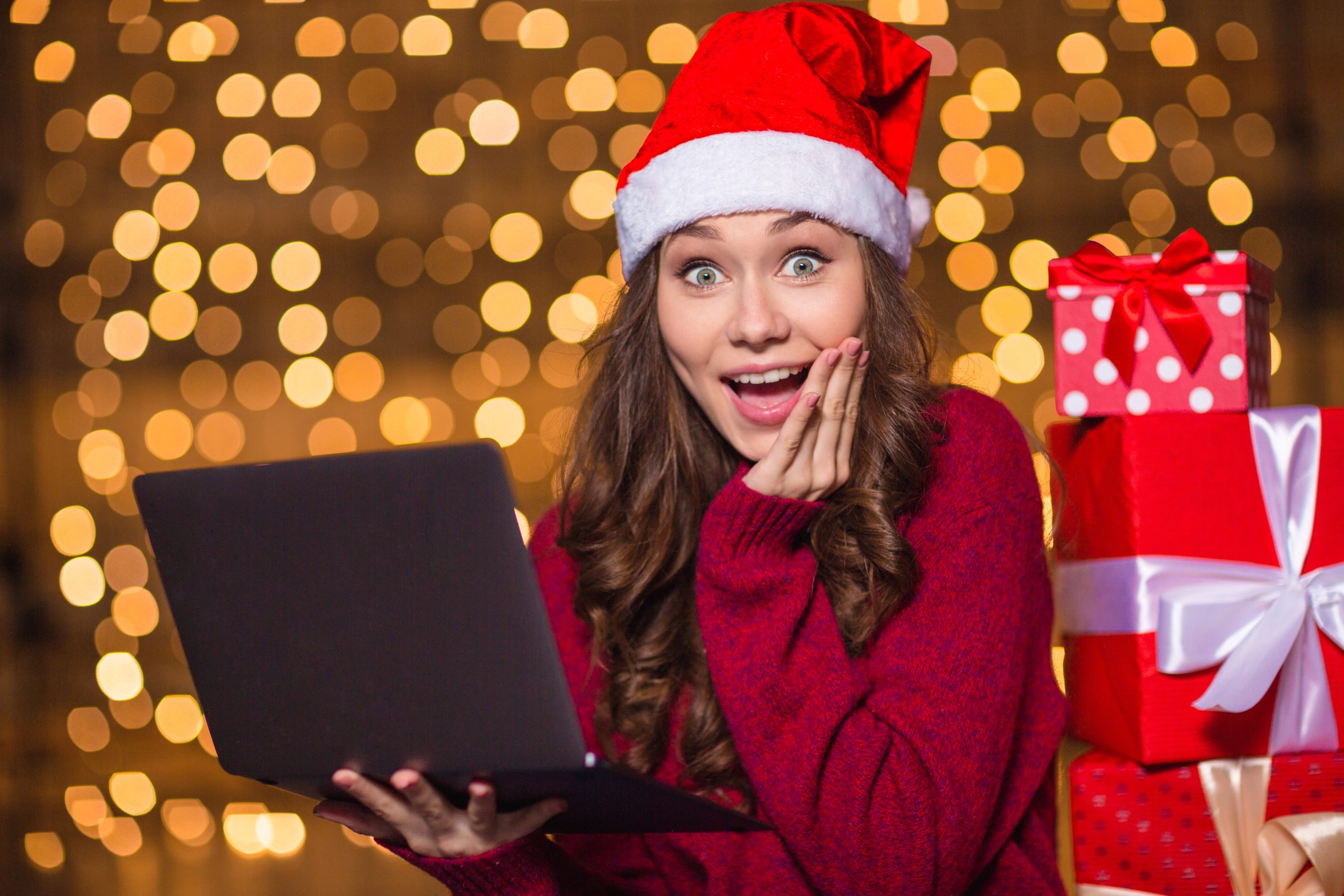 surprised woman opening secret santa gift