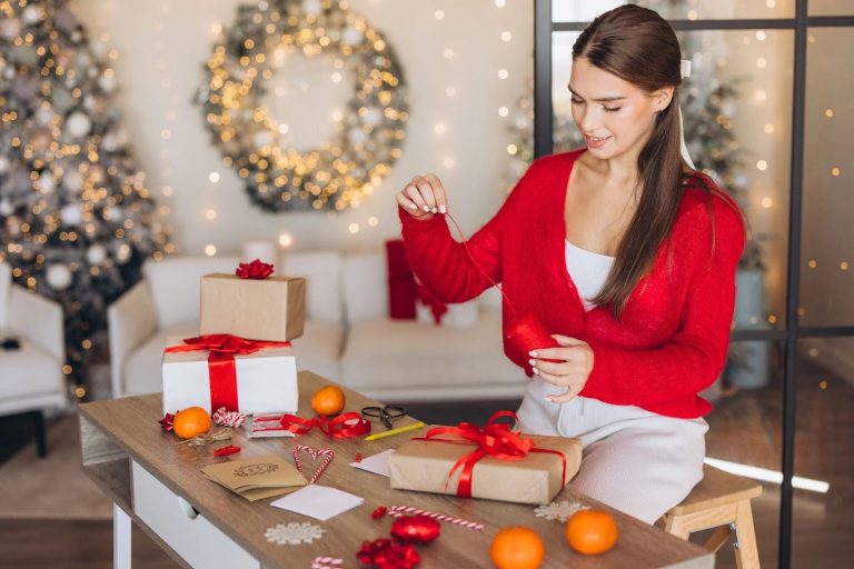 woman wrapping christmas gifts