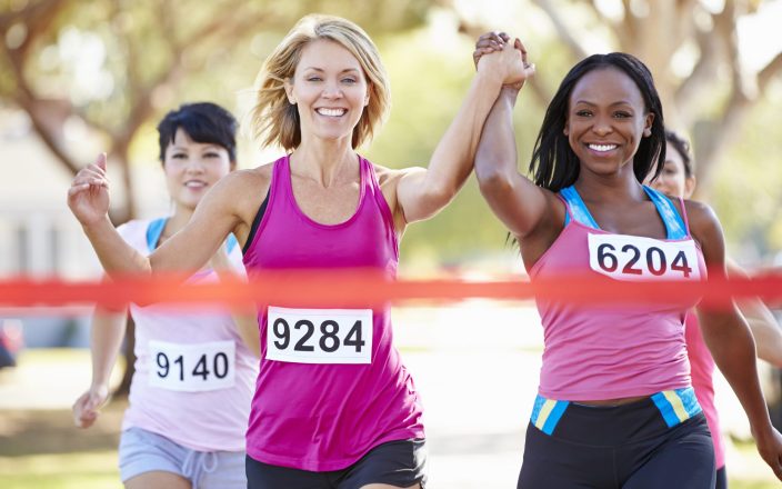 women running marathon together