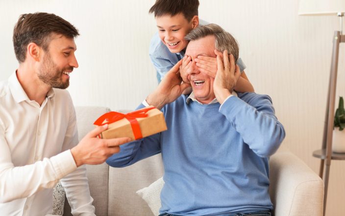 Grandpa getting gift from son