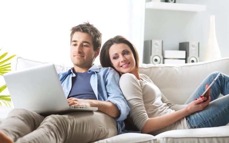 couple creating gift registry together on computer
