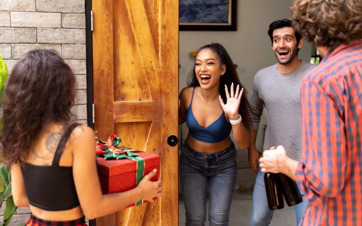 couple receiving housewarming party guests