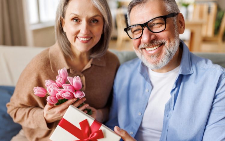 grandma and grandpa happy with christmas gift
