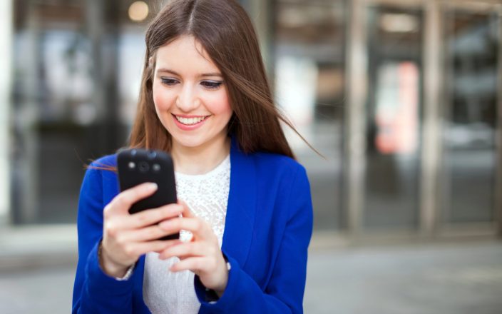 happy young woman using myregistry phone app