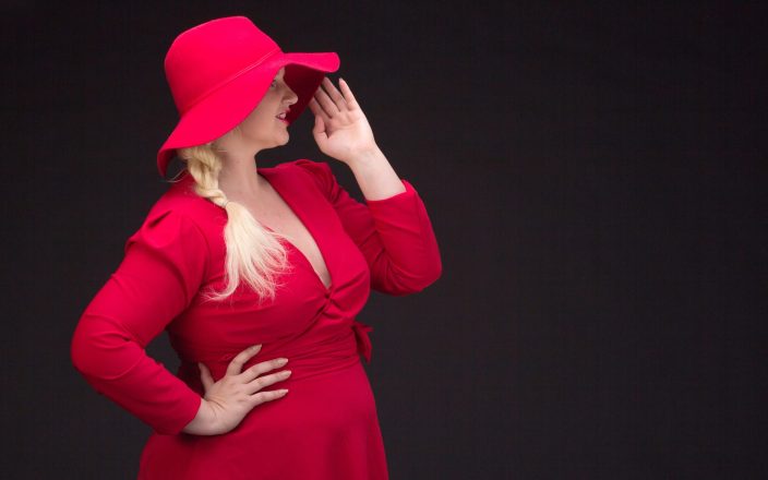 woman with elegant red plus size holiday dress