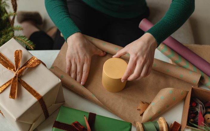 close-up-of-woman-wrapping-christmas-present