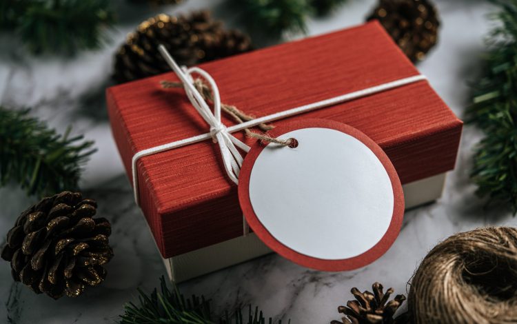 Gift boxes with small gifts on white cement