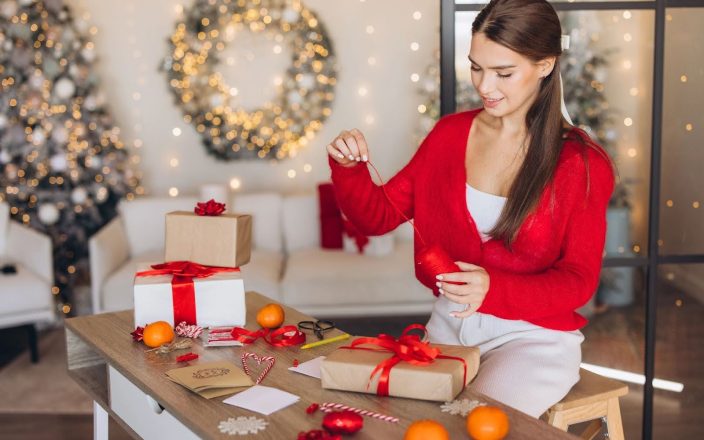 woman wrapping christmas gifts