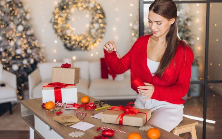 woman wrapping christmas gifts